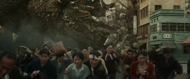 File:Minus One - Godzilla swinging his tail through a Ginza block.png