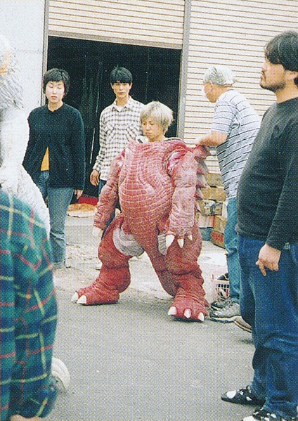 File:Rie Ota testing Baragon suit.png