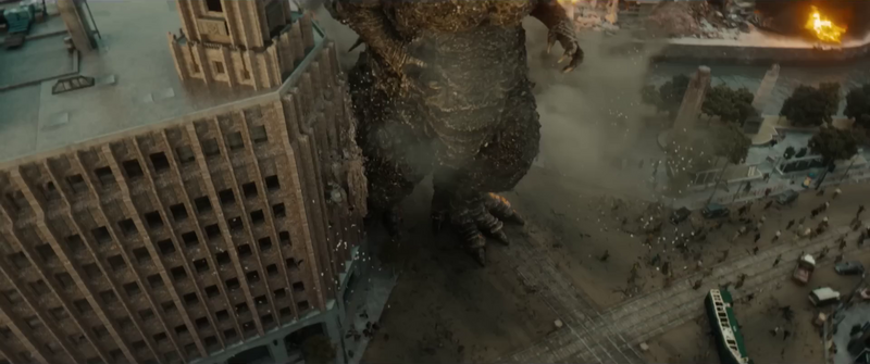 File:Minus One - Godzilla crashing through a building.png