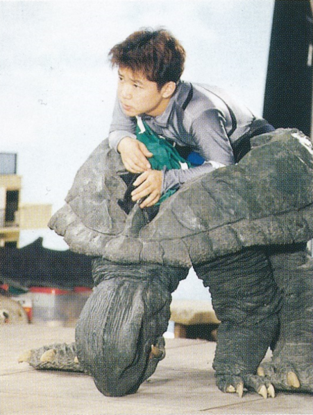 File:GGOTU - Jun Suzuki in Gamera suit.png