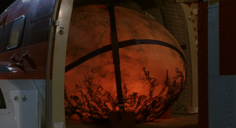File:Godzilla vs. Mechagodzilla II - BabyGodzilla's egg glowing orange.png